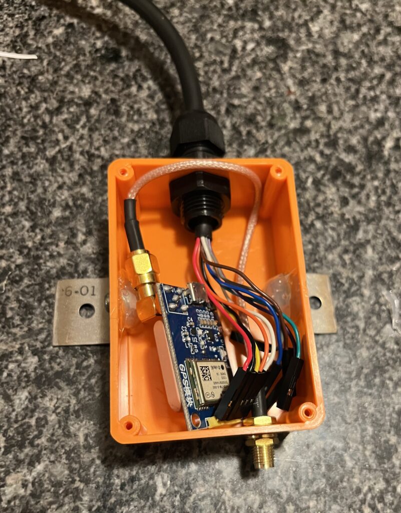 GPS board fit into the case with hot glue covering the nuts holding the external brackets in place.