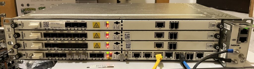 Alcatel-Lucent 9926 BBUv2 chassis with bCAM2 board in the bottom slot and three bCEM2 modem boards above it.